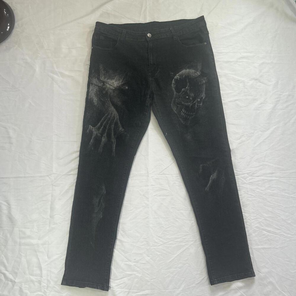 Black slim denim jeans with skulls and scream ghoul mask, demon design.